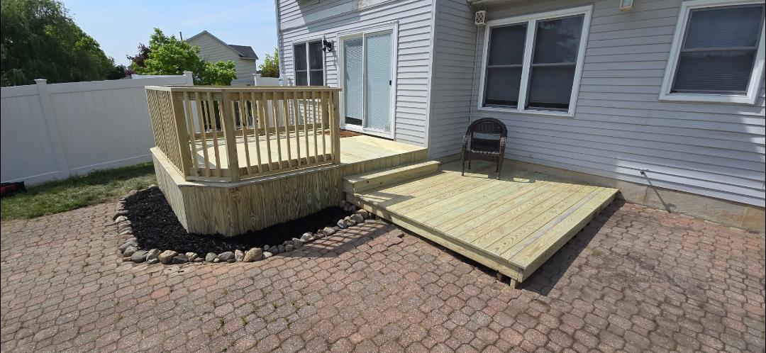 Image of a new wood deck and patio constructed by Kaier Property Management.